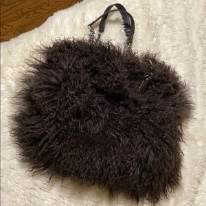 Aqua Madonna sheepskin hand bag.